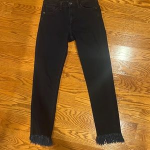 Black jeans, frayed edges